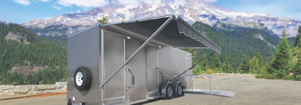 Custom trailer in a parking lot on a mountain